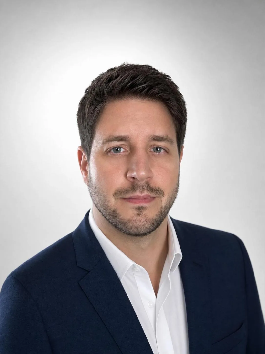 AI-generated professional business headshot of the same man from his selfie